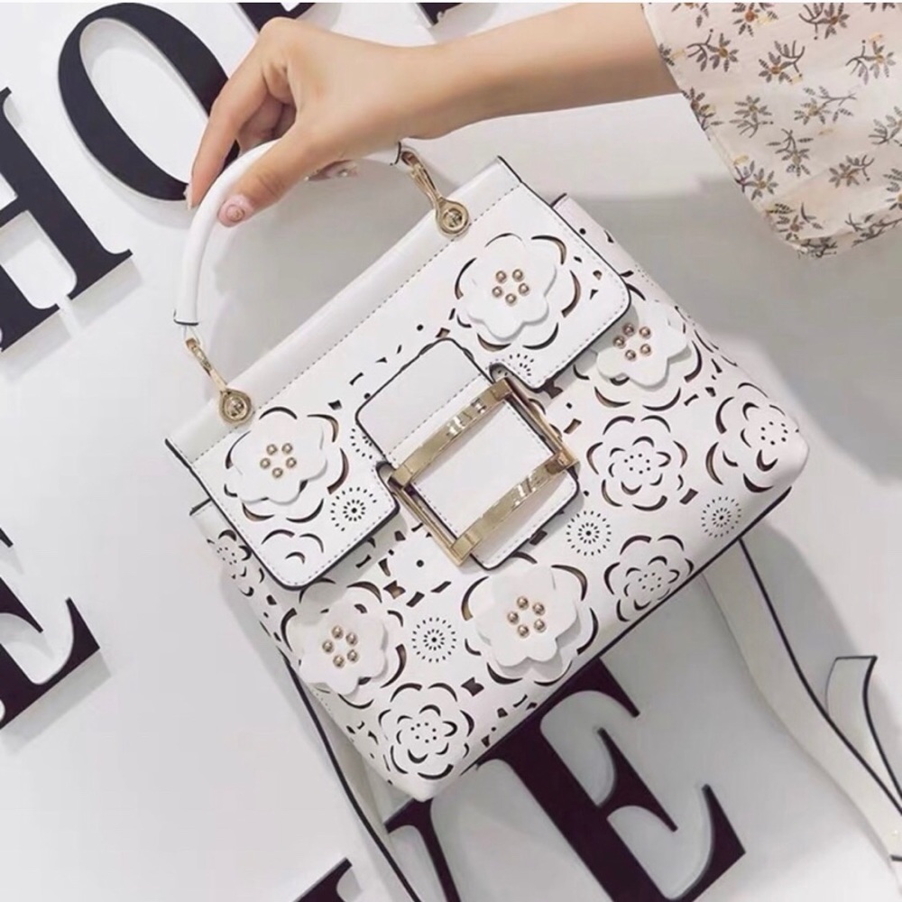 White hallow cut-out flower leather handbag